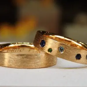 Multistones wedding band rings set in certified fairmined gold with Fair Trade sapphire, topaz, aquamarine & emerald